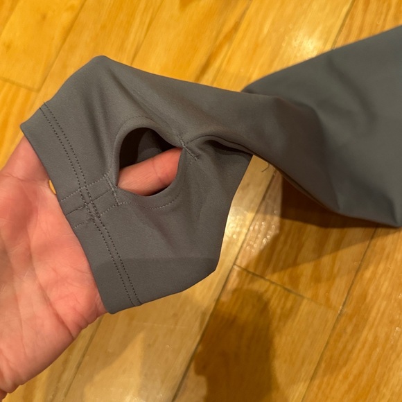 Alo Yoga Airlift Warm Hooded Runner in gray with a brushed interior for warmth. - Picture 4 of 6